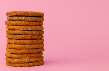 Stack of round oat cookies on paper background
