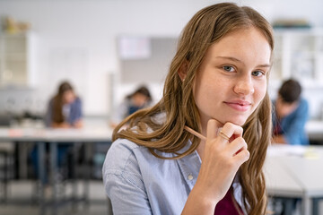 Portrait of girl in high school classroom