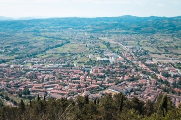 Fototapeta na wymiar Panoramic view from above of the medieval Italian village of Gubbio with old buildings (Umbria, Italy, Europe)