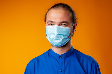 Middle-aged caucasian man wearing medical face mask.