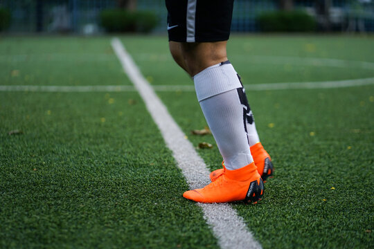 Bangkok / Thailand - June 2018 : Football player training on artificial grass field. Wearing Nike Mercurial Superfly VI, the famous football boots for speedy player like Cristiano Ronaldo and Neymar. 