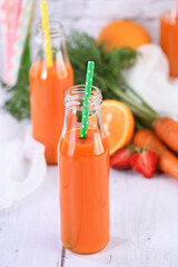 Detox drink. Freshly made Carrot Strawberry Orange Juice. For those who monitor their health
