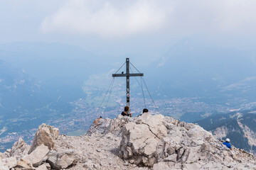 Fototapeta na wymiar Summit cross at Alpspitze via ferrata in Garmisch-Partenkirchen, Bavaria, Germany
