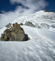 Mountaineering on the way up from Cabanne des Vignettes to Pigne d´Arolla in Swiss alps