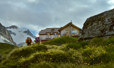 hikers on their way to the Taschachhaus mountain hut in Pitztal, Alps, Austria