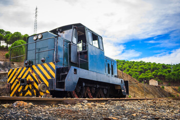 Fototapeta na wymiar abandoned locomotive and train tracks