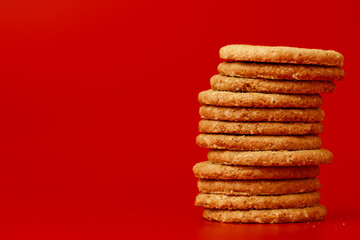 Stack of round oat cookies on paper background