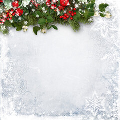 Naklejka na ściany i meble Christmas decorations on wood background. border with fir branches, red berries and snowberry. Copy space