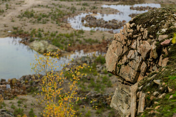 Obraz na płótnie Canvas stones at the quarry, autumn is cloudy