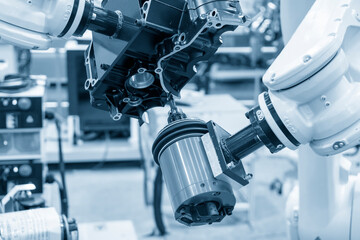 The milling spindle attached on the robotic arm  finishing cut the gearbox parts. The automotive...