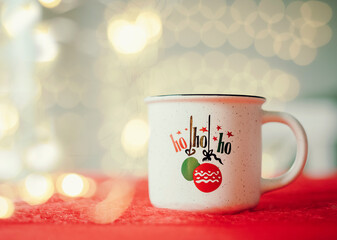 Obraz na płótnie Canvas Christmas cup with coffee on red table