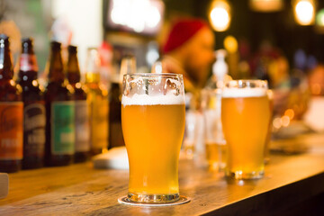  Beer in a glass stands on the table in the bar.