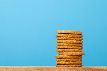 Stack of round oat cookies on paper background