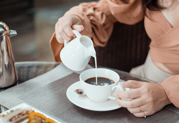 Cup of coffee on table in cafe. Morning coffee, drinking hot coffee and enjoying morning