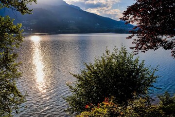 Photo Lake Lago di Caldonazzo on the Background of Dolomites in Italy