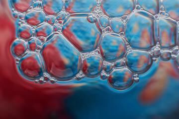 blurry abstract background of colored soap bubbles in water