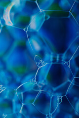 blurry abstract background of colored soap bubbles in water