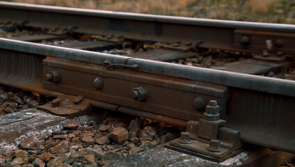 Rail rails on sleepers with bolts and nuts