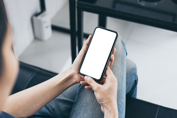 cell phone blank white screen mockup.woman hand holding texting using mobile on desk at office.background empty space for advertise.work people contact marketing business,technology