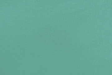 Turquoise homogeneous background with a textured surface