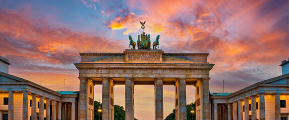 Panorama of the Brandenburg gate illuminated at sunset in Berlin, Germany