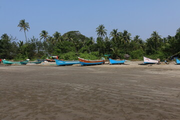 Fototapeta na wymiar fishing boats on the sea shore, India
