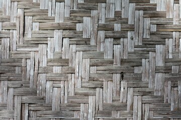 background of old bamboo interlace pattern ,part of hut wall in phuket  island thailand