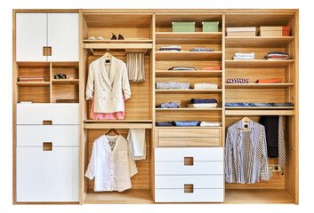Modern wardrobe with clothes hanging on slide out racks and folded on the shelves. Modern furniture
