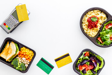 Food delivery payment with terminal and lunch boxes with meal