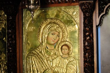 Greek orthodox icon of Virgin Mary with Jesus Christ. The icon is handcrafted and covered with gold - Athens, Greece, March 12 2020.