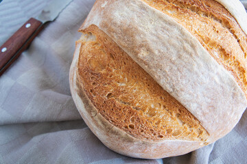 Homemade round bread of wheat flour and spelt