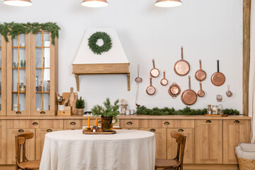 Rustic kitchen details for Christmas. Rustic kitchen table setting and decor for New Year close-up and copy space.