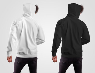 Template of fashionable casual hoodie on a guy in a hood, back view, white and black sweatshirt,...