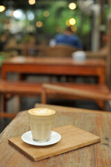 Cup of coffee on table in cafe - vintage style effect picture