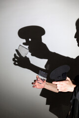 play shadow projected against a white background. a cook