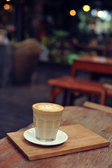 Cup of coffee on table in cafe - vintage style effect picture