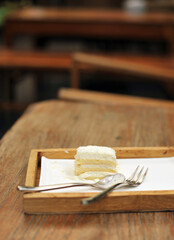 Cake Vanilla buttercream on a wood plate in cafe