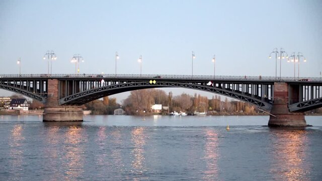 Slow pan of the Theodor Heuss Bridge in Mainz with cars driving on it.