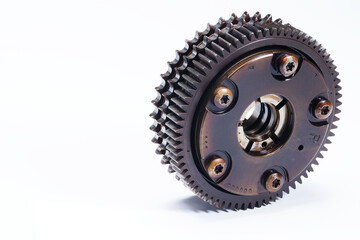 The mechanism for changing the timing of the timing. Exhaust camshaft regulator stands on the teeth in a half turn. Intake shaft gear, isolated on a white background. Camshaft timing.