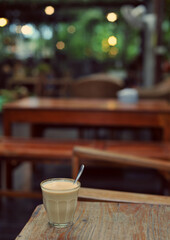 Cup of coffee on table in cafe - vintage style effect picture