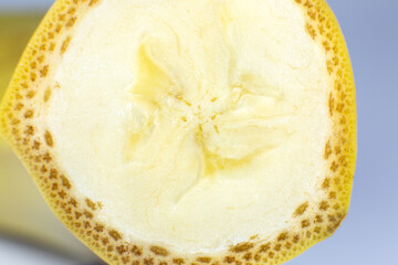 Close up photo of banana on white background. Bananas fruit cut in half, macro view.