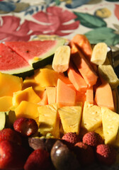 Fototapeta na wymiar FOOD- Beautifully Colorful Freshly Cut Fruits and Berries