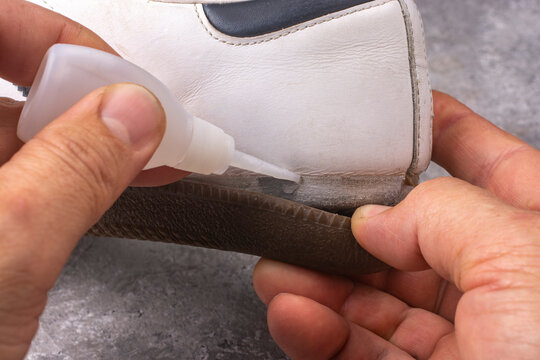 Repairing sneakers with glue. Repair of shoe soles.