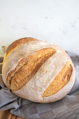 Homemade round bread of wheat flour and spelt
