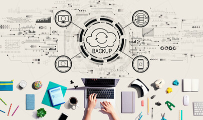 Backup concept with person using a laptop computer