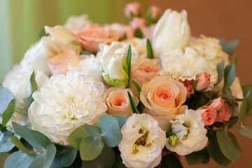 Delicate bouquet of flowers, roses, freesia, eucalyptus, dahlias, tulips. Floral background, soft selective focus. Concept March 8, Mother's, Valentine's, International Women's Day. Horizontal