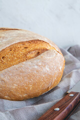 Homemade round bread of wheat flour and spelt