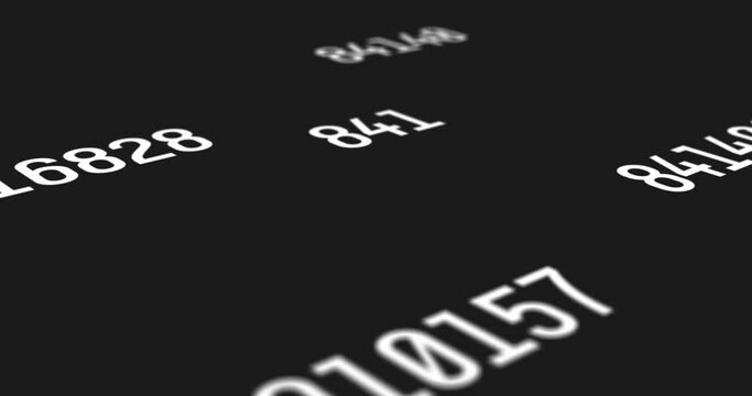 Sets of random numbers with a white font color projected on a black screen background