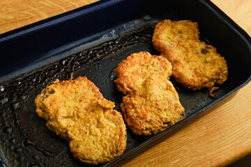 Inside out beef schnitzel on cooking pan