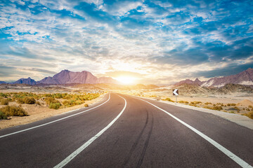 Naklejka premium Clouds over road